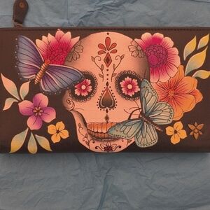 Anna by Anuschka Bi-fold snap wallet. "Day of the Dead". Main color is black.